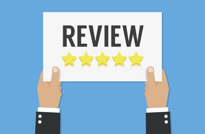 Business hand holding a smartphone, giving a five-star review