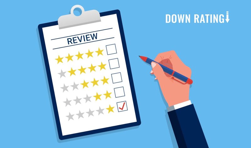 Hand holding a negative review, representing customer complaints or feedback