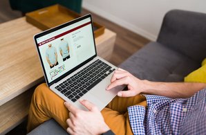 young-man-buying-clothes-online